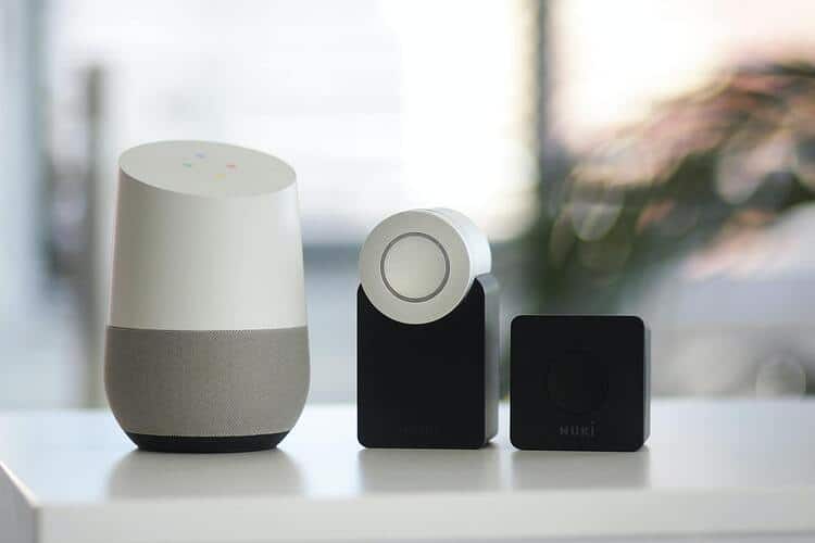 Three random smart devices in a row sitting on a countertop