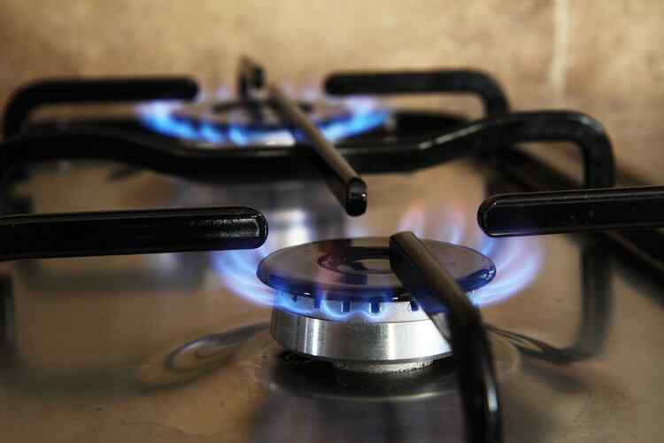 Close-up of gas stove turned on